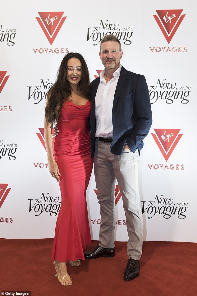 Nathan Buckley and new girlfriend Brodie Ryan were still doting on each other as they made a date night of the launch of Virgin Voyages Resilient Lady Melbourne on Sunday.  Both shown