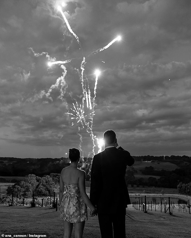 In a second frame, the couple is seen with their backs to the camera in a rural setting, watching a fireworks show