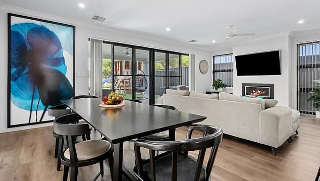 Located in Adelaide, in the coastal suburb of West Lakes, 12km from the CBD, the luxury pad features four bedrooms and three bathrooms.  Pictured: the kitchen and dining area