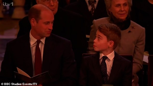 Prince William shared a loving look with Prince George during the annual Christmas carol concert held at Westminster Abbey last night.  George, 10, looked up at his father as actor Jim Broadbent read JRR Tolkien's The Father Christmas Letters.  William then gave his son a quick smile before turning his attention back to the service