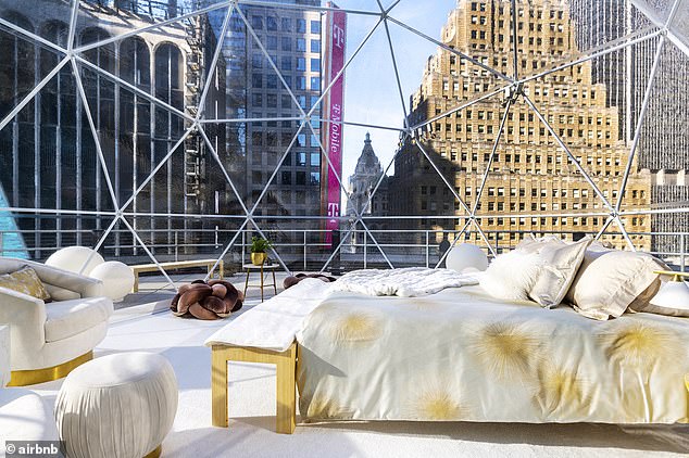 Airbnb will use artificial intelligence to tackle unauthorized New Year's Eve parties and ban violators from the platform.  Pictured: a dome near Times Square for which Mariah Carey served as Airbnb host in 2020