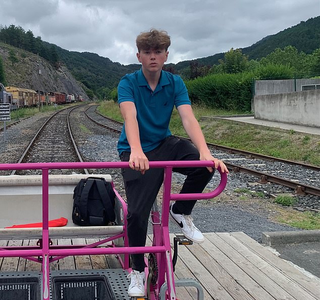 British teenager Alex Batty (pictured cycling in France) has urged his mother not to turn himself in after police launched a criminal investigation into his alleged kidnapping six years ago