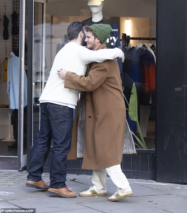 The actor met a friend outside Percival, a menswear store in Hackney, and gave him a warm hug