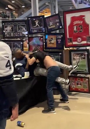 At one point, the two men came very close to knocking over a memorabilia stand