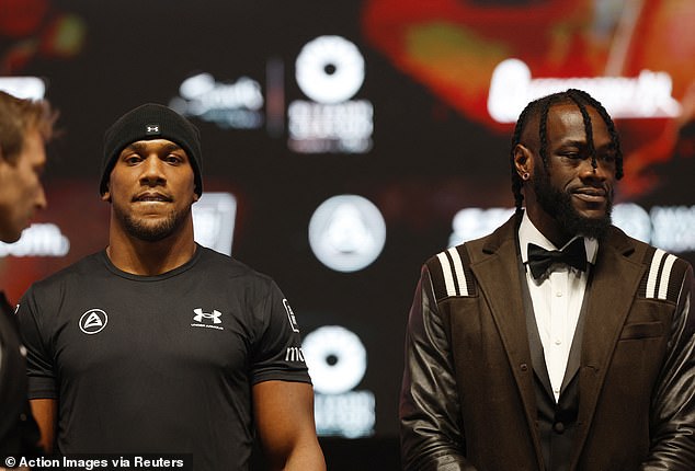 Deontay Wilder, right, has previously claimed that Anthony Joshua's promoters had held up a fight