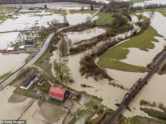 At least two people have died as a result of atmospheric rivers that have inundated Washington state and Oregon with flooding in recent days.