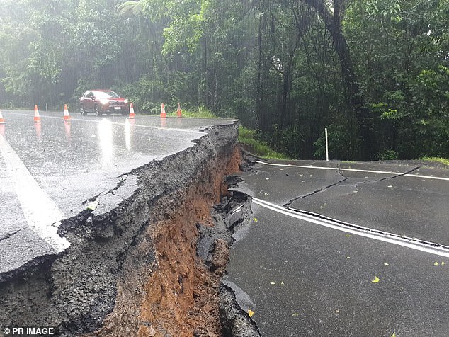 The Palmerston Highway in far north Queensland has split in two after heavy rain and flooding from ex-tropical Cyclone Jasper.