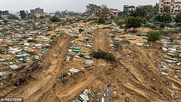 Graves damaged during the Israeli ground offensive are seen in the Fallujah neighborhood, amid the ongoing conflict between Israel and the Palestinian Islamist group Hamas, in Jabalia in the northern Gaza Strip, December 13, 2023