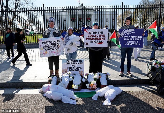 On November 29, demonstrators are seen outside the White House calling for an end to the war