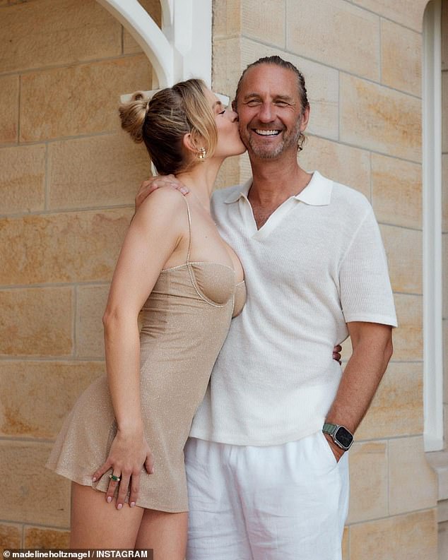 Justin Hemmes, 50, celebrated Christmas surrounded by friends at his $100 million mansion in Vaucluse, Sydney, on Wednesday.  Pictured with girlfriend Madeline Holtznagel at their home in October