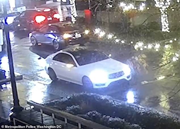 Video shows the suspects exiting a white vehicle before rushing into the North West town center store.  Pictured above is the white sedan the suspects are believed to have been traveling in