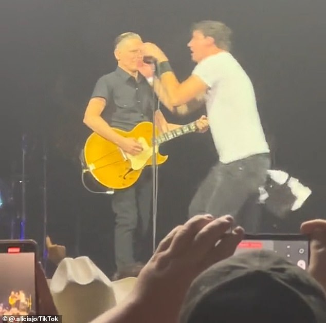 In July this year, a crazed fan rushed on stage to sing along to a performing Bryan, before being pushed off stage by the rocker's security.