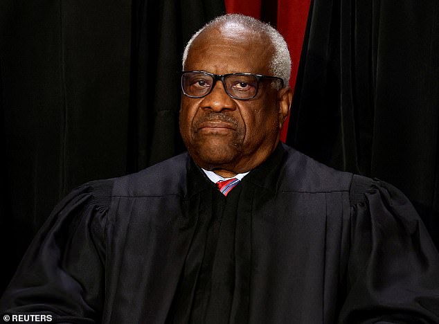 Judge Clarence Thomas, seen in his official portrait in 2022, should be relieved of future rulings related to Trump's removal from the ballot in Colorado and Maine, according to Democrat Congressman Jamie Raskin