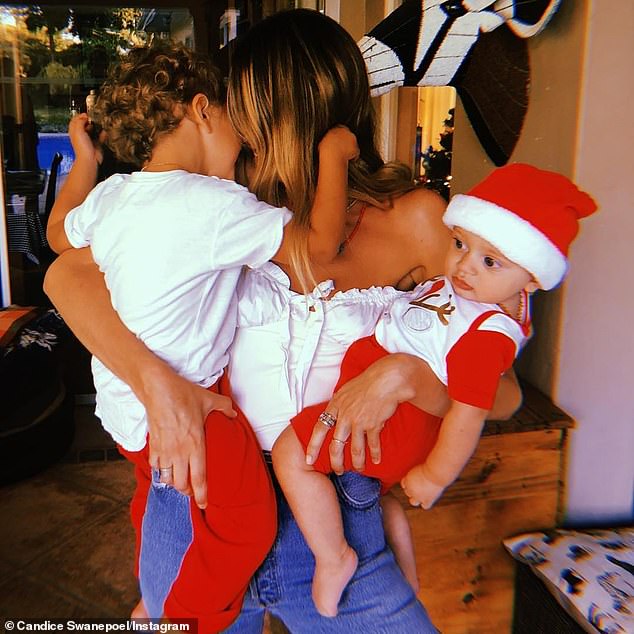 Candice is mother to sons Anaca, seven, and Ariel, five, with Brazilian model Hermann Nicoli;  pictured in December 2018 with her sons