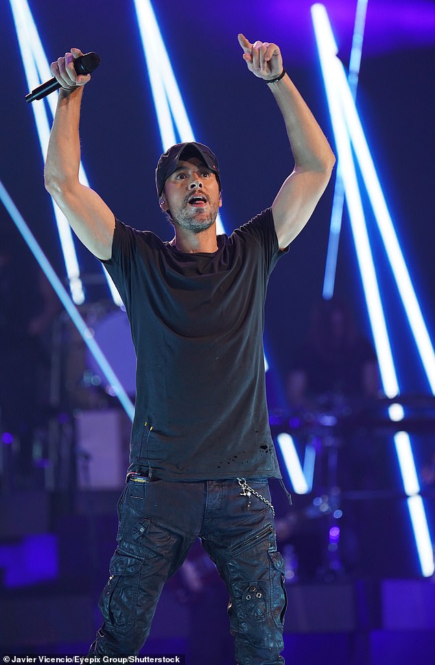 Iglesias shot his hands in the air during his show in Dallas