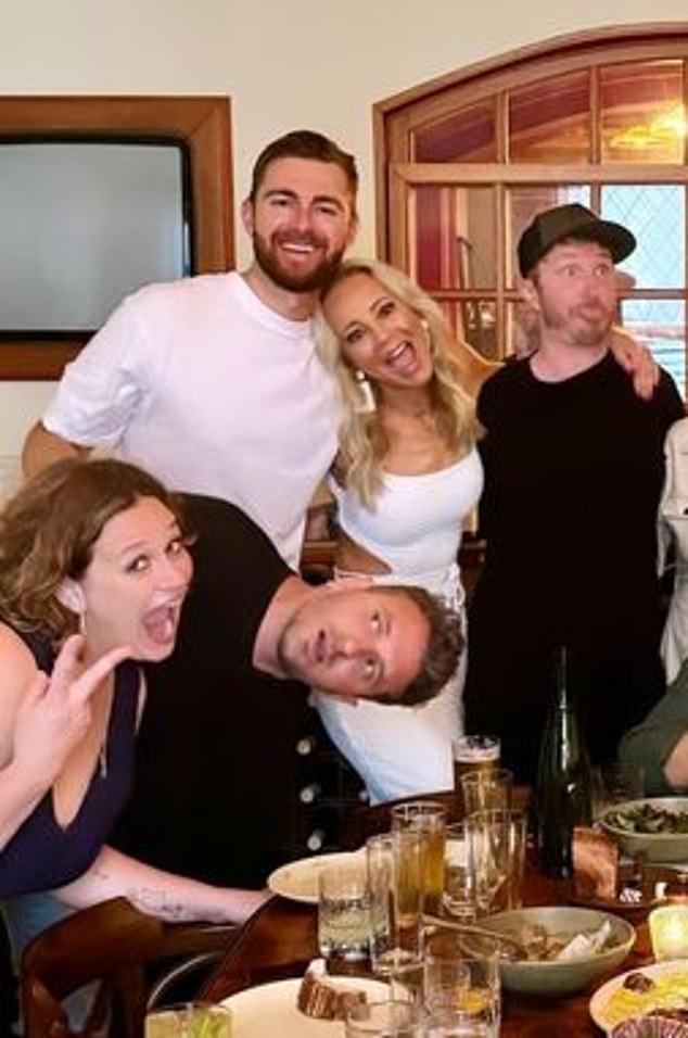 Carrie Bickmore (center) and Tommy Little (bottom right) celebrated the success of their Hit FM radio show in style by attending an intimate Christmas party.  Bickmore, 43, shared a photo on Instagram of herself posing up a storm with Tommy, 38, in the chic restaurant