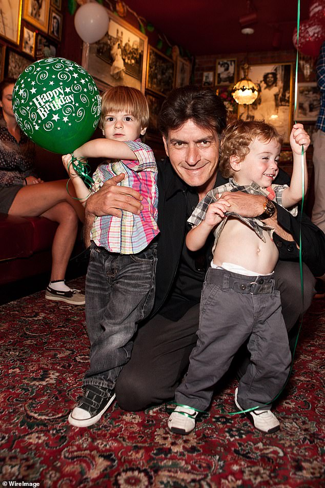 Sheen and Mueller welcomed the two children in 2008 during their turbulent three-year marriage from 2008-2011;  he is seen with his sons in September 2011