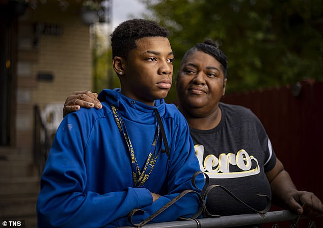 JaQuwaun Williams (pictured), pictured with his grandmother Lynida Williams-Saddler (right) at their Gresham home, was struck by an off-duty police officer outside his former school earlier this year