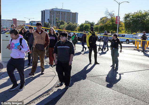 Students are seen evacuating the scene of Wednesday's shooting on the University of Nevada campus