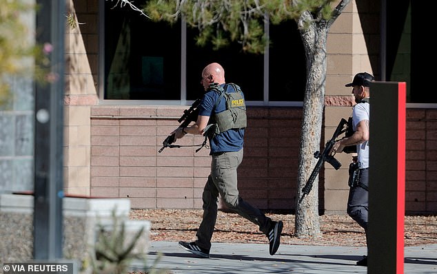 Law enforcement officers enter the UNLV campus after reports of an active shooter in Las Vegas, Nevada, U.S., December 6, 2023