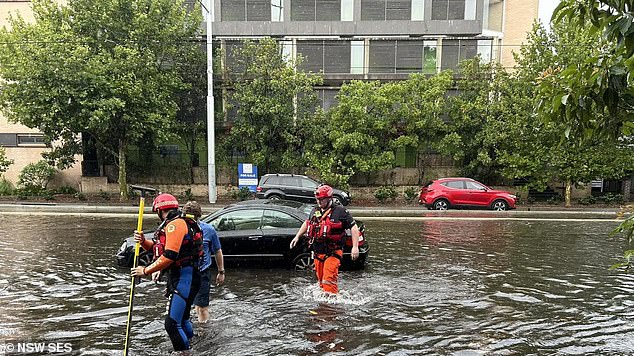 One vehicle stranded on Anzac Parade in Kensington had to be rescued by SES on Sunday (pictured)