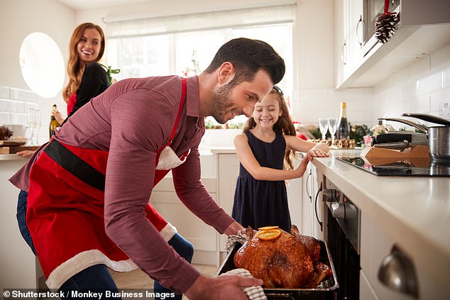 Cooking Christmas dinner may require opening a window, as evidence suggests it brings indoor pollution to the highest point of the year (stock image)