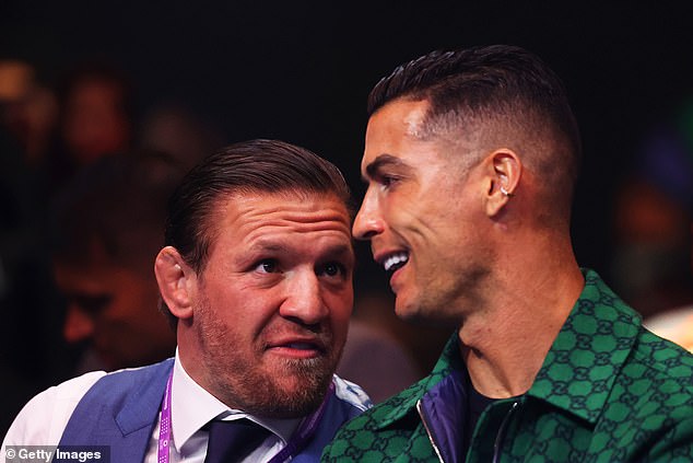 Cristiano Ronaldo sits next to Conor McGregor at the Day