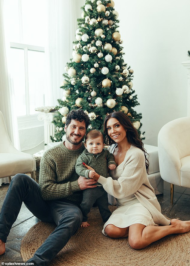 Dancing With The Stars pros Jenna Johnson and Val Chmerkovskiy looked delighted as they posed with their son Rome for a Christmas shoot this week