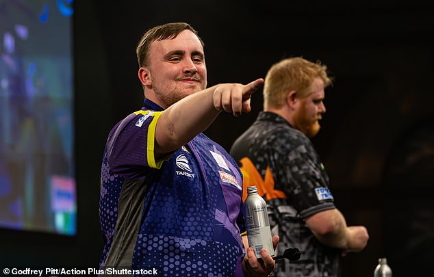 Darts sensation Luke The Nuke Littler 16 poses with forgotten