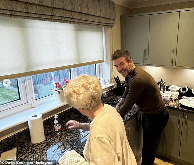 David Beckham showed on Thursday that he is still willing to get his hands dirty when he got to work washing the dishes with his mother Sandra