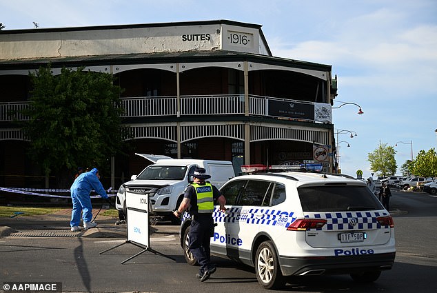 A driver has been charged over a crash that left five members of two young families dead after an SUV crashed through a crowded pub beer garden (pictured, officers on scene)