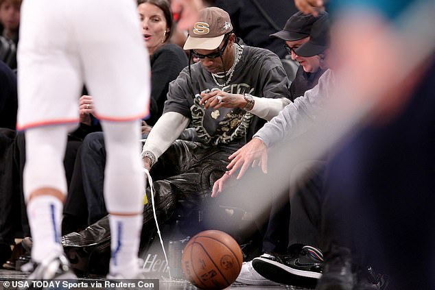 Despair for Travis Scott as rappers drink EXPLODES at courtside