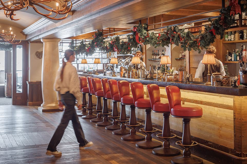 Drink it all up: the hotel bar has 'stylish' red stools.  Ted says everyone at the hotel 'seemed to be having a great time'
