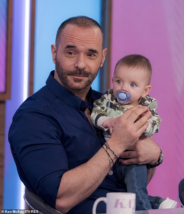 Former EastEnders actor Michael Greco has revealed he is expecting his second child with partner Helen Harris (pictured with their firstborn Gianluca)