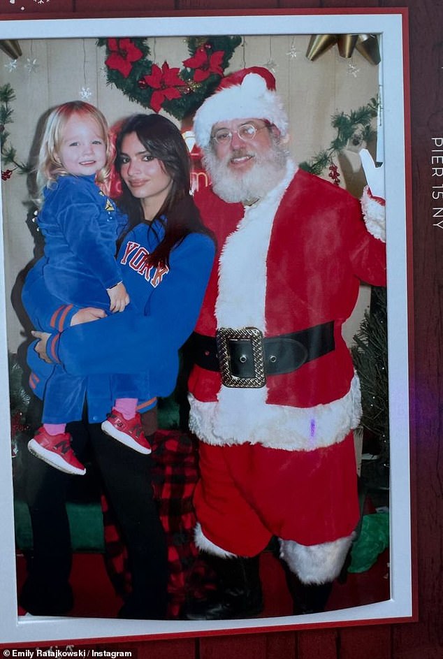 Emily Ratajkowski gave fans a glimpse into her wholesome holiday fun by sharing a photo of her son Sylvester meeting Santa Claus