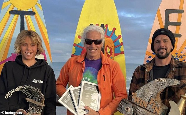 Khai Cowley (pictured left with his grandfather Peter and uncle Adam) was killed by a shark while surfing on Thursday