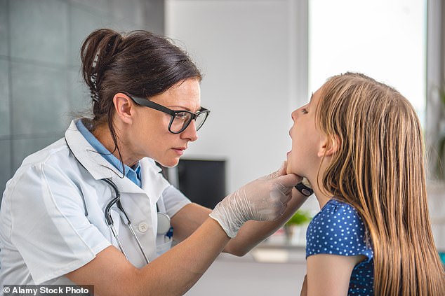 During a tonsillectomy, doctors place a tool in the child's mouth to cut or shave away the two oval-shaped cushions of tissue at the back of the throat.  They can also use a method called cautery to burn them.