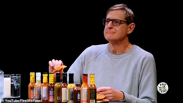 Louis Theroux is pictured taking part in a Hot Ones interview on YouTube.  The documentary filmmaker is seen struggling to keep it together as he nibbles down chicken with an extremely spicy sauce