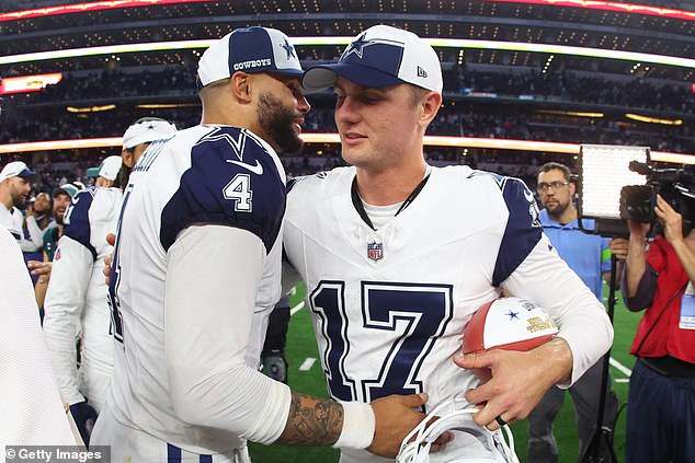 Dak Prescott celebrates with Brandon Aubrey (right) after receiving the game ball