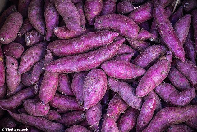 Purple foods are popular among health conscious people because they contain anthocyanins, which reduce inflammation.  Pictured are piles of purple sweet potatoes at the vegetable market