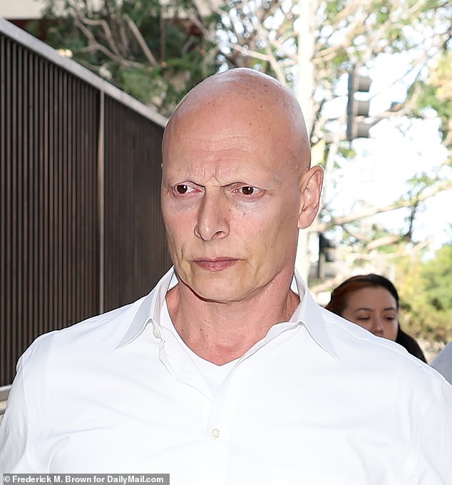 The 51-year-old British actor - striking for his shiny, bald head - appeared in court in downtown LA on Monday