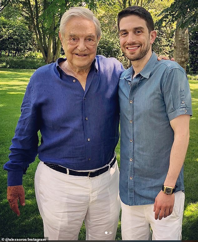 The elder Soros is seen here with his son Alex, who formally took control of his family's inheritance earlier this year