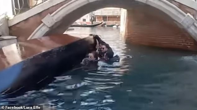 The tourists were pictured in the canal after falling from the boat as it passed a bridge