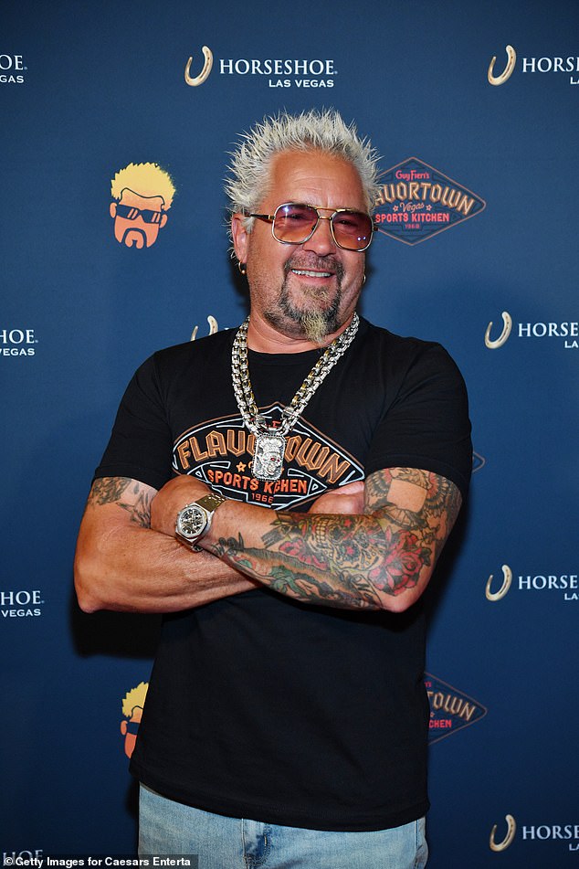 Guy Fieri, 55, says he doesn't plan to leave his sons Hunter and Ryder any money in his will unless they get some degrees.  Pictured in Las Vegas in July