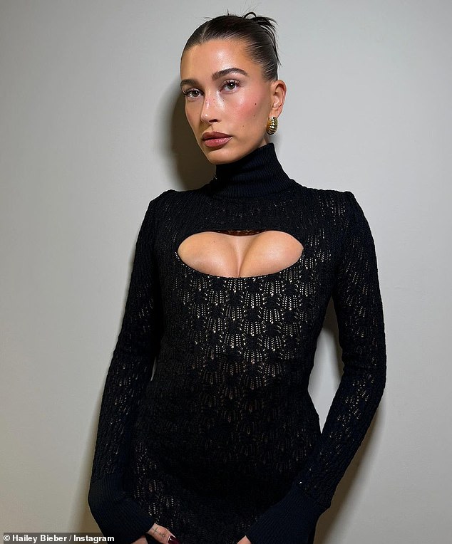 Hailey Bieber, 27, took to Instagram on Saturday with a number of sizzling snaps.  She stunned in a figure-hugging, sheer black dress with a cutout that showed off her cleavage