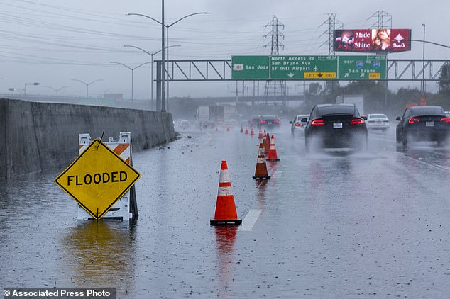 Southbound lanes on US Highway 101 in South San Francisco, California flooding during a storm on Wednesday, December 20, 2023