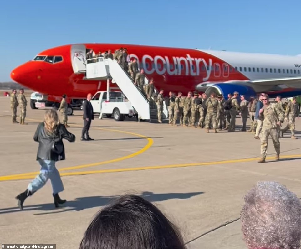 A woman rushed into the arms of her soldier after landing at an Air Force base in Nebraska