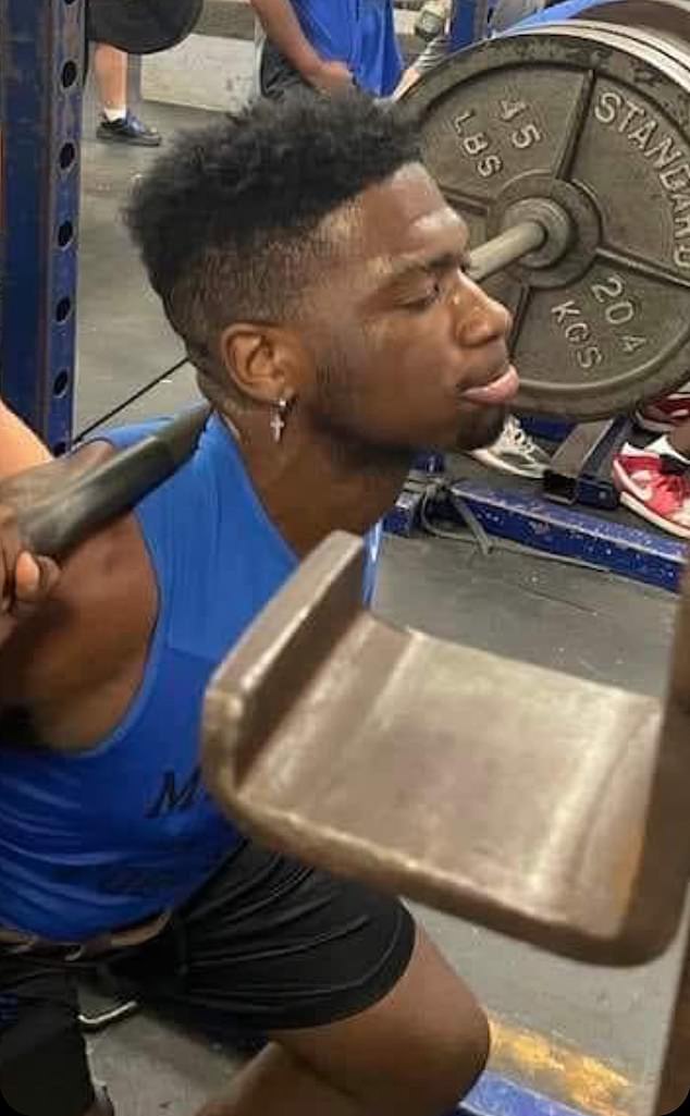 Brandon Smith sees an undated photo lifting weights.  The teen has been pronounced dead.