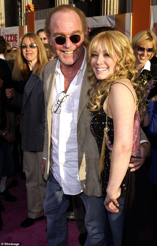 Hilary Duff paid tribute to Stan Rogow, who was executive producer of her breakout show Lizzie McGuire, after his death on Thursday at the age of 75;  they are pictured together at the April 2003 premiere of the Lizzie McGuire film