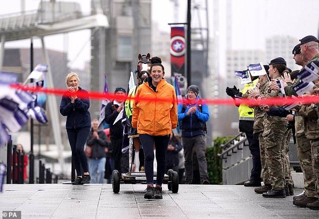 Emma Webb arrives at the London International Horse Show at ExCel London at the end of her 155 mile walk in memory of her late daughter